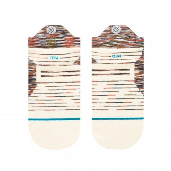 A pair of low-cut socks with a multicolor horizontal stripe pattern on the upper half and a solid cream-colored lower half, displayed flat against a white background.